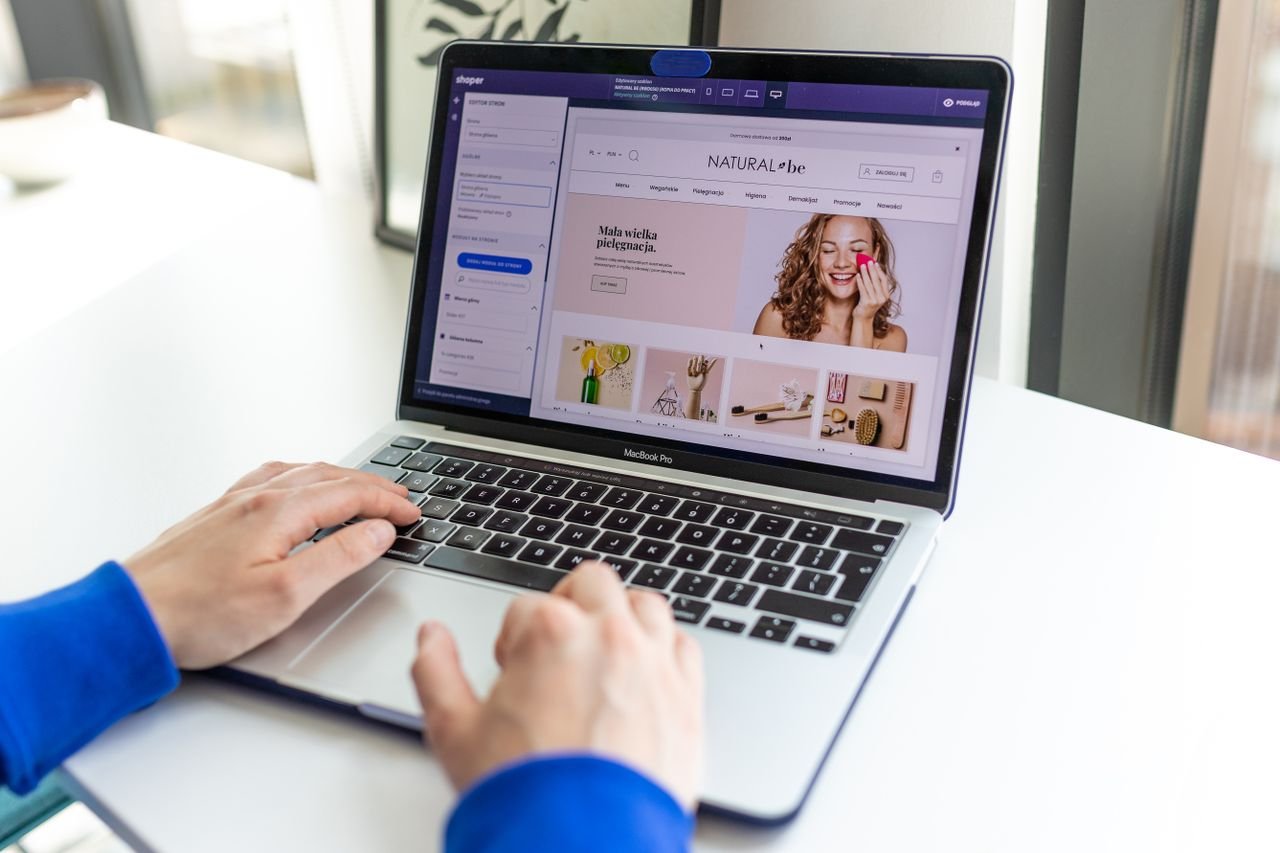 Crafting Captivating Headlines: Your awesome post title goes here Hands typing on a laptop with an e-commerce website open, showcasing online shopping.